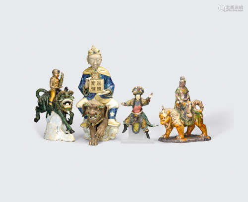 A group of four glazed pottery figures