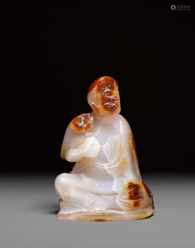 A carved agate seated louhan