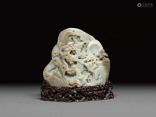 A GREEN AND BROWN JADE BOULDER   20th century