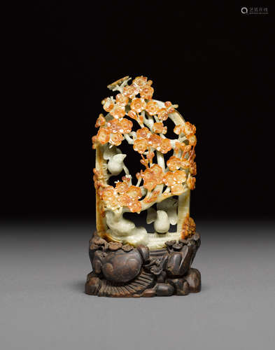 A GREEN AND RUSSET JADEITE 'MAGPIE AND PLUM BLOSSOM' CARVING  20th century