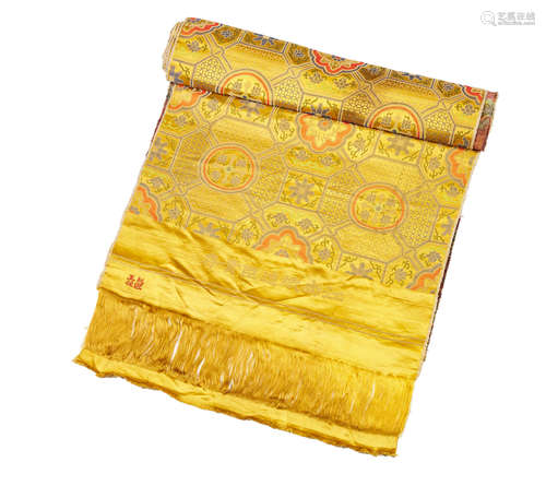 A bolt of yellow ground brocade-woven silk