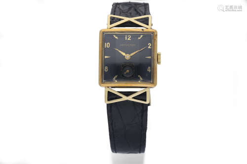 Hamilton. A 14K Yellow Gold Square Wristwatch with Unusual Lugs, Black Dial and Faceted Glass