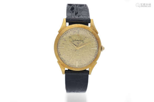 Mathey-Tissot. A Yellow Gold Wristwatch with Textured Dial and Power Reserve