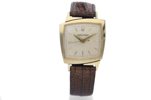 Bulova. A 14K Yellow Gold Electronic Wristwatch