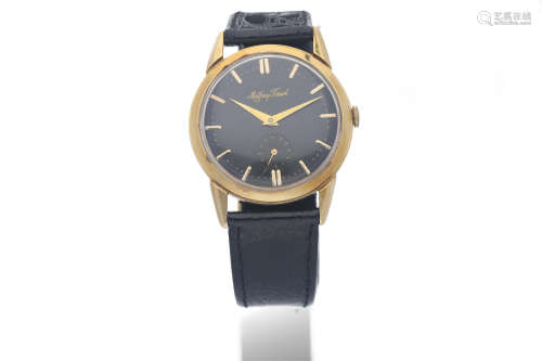 Mathey-Tissot. A 14K Yellow Gold Wristwatch with Black Dial