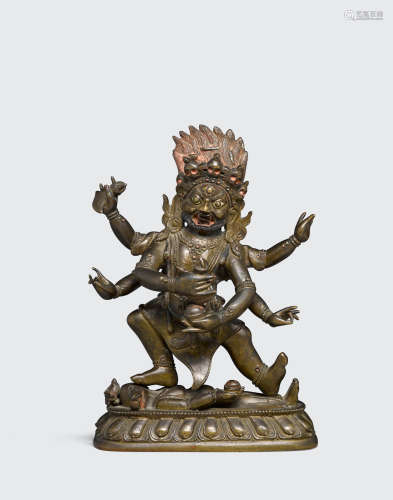 18th/19th century A cast bronze figure of a dharmapala