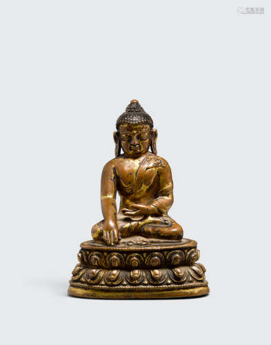 Nepal, 14th century A gilt bronze figure of akshobhya
