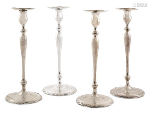 by Shreve & Co., San Francisco, CA, 20th century  Four American sterling silver base loaded candlesticks