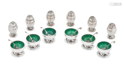 by Georg Jensen, Copenhagen, marked 2A and 110, 20th century  A collection of Danish sterling silver salt cellars with spoons and pepper casters