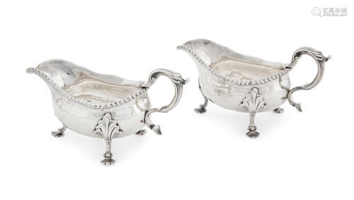 London, circa 1768  A pair of English sterling silver sauce boats