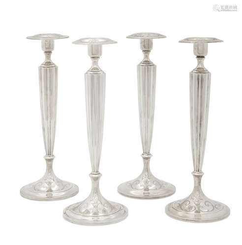 by Shreve & Co., San Francisco, CA, 20th century  An American sterling silver set of four candlesticks