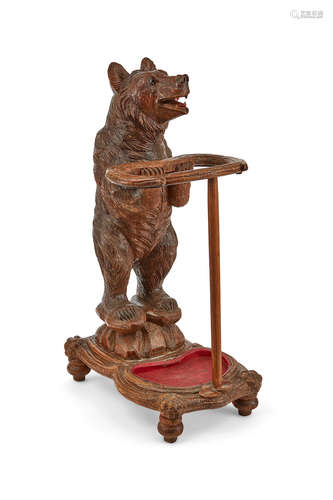 Probably Swiss, third quarter 19th century A Black Forest Carved Wood Bear Form Umbrella Stand