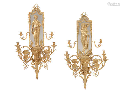 20th century A Pair of Louis XVI Style Gilt Bronze Five Light Figural Sconces