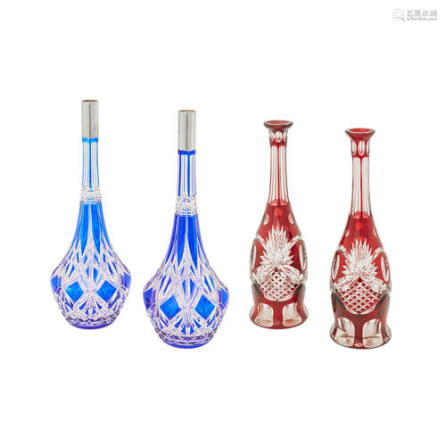 Two pairs of cut to clear cranberry and cobalt blue glass decanters