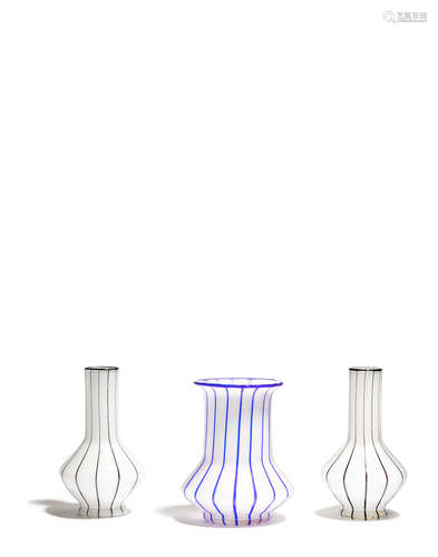 for Loetz Witwe, Circa 1914With blue or black stripes.heights 7 1/4in (18.5cm) and 7 3/4in (20cm)  Three Austrian opaline glass Tango Vases Attributed to Michael Powolny (1871-1954)