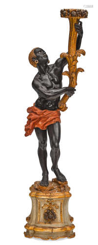 A Venetian Baroque style carved wood figural torchère