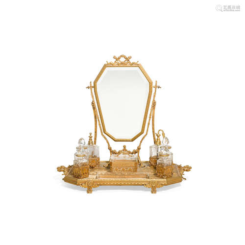 Late 19th century A Louis XVI style gilt bronze and engraved glass dressing mirror and fitted tray