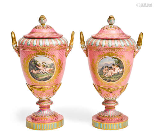 Late 19th/early 20th century A Pair of Berlin (K.P.M.) gilt and polchromed pink ground porcelain covered urns