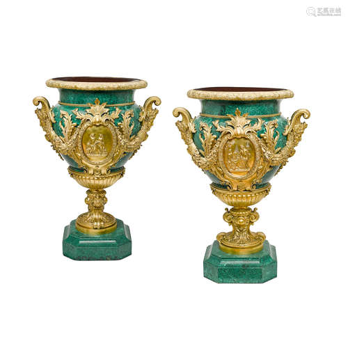 Late 19th/early 20th century A Pair of Régence style gilt bronze mounted malachite urns