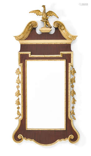 Circa 1900 A George II style parcel gilt mahogany mirror