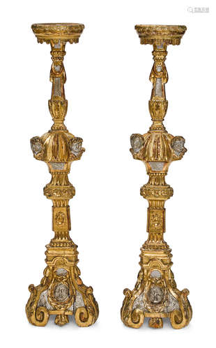 A pair of Italian Baroque carved giltwood floor prickets