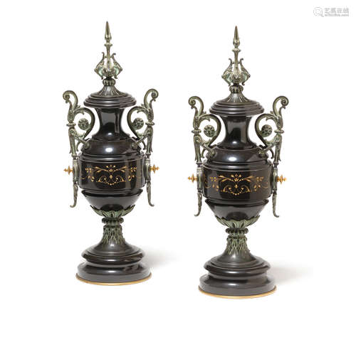 A Pair of Napoleon III style bronze mounted gilt incised black marble urns