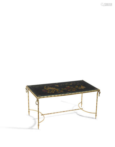 circa 1950height 17in (43.2cm); width 36in (92cm); depth 19in (49cm)  A Maison Bagues brass, carved and polychromed wood and glass Coffee Table