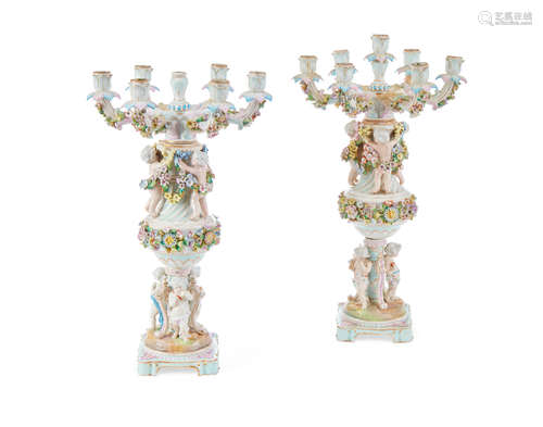 A pair of German porcelain seven light candelabra