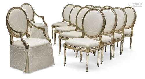 In the manner of Maison Jansen, 20th century Set of Twelve Neoclassical Style silver giltwood dining chairs