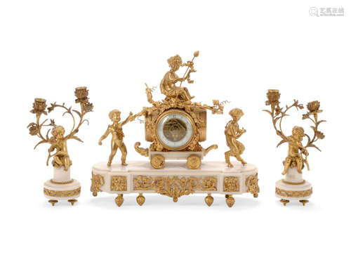 Late 19th/early 20 century A Louis XVI Style Gilt Bronze and White Marble Three Piece Clock Garniture