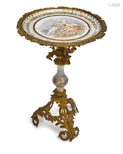 Third quarter 19th century A Napoleon III gilt bronze and porcelain guéridon