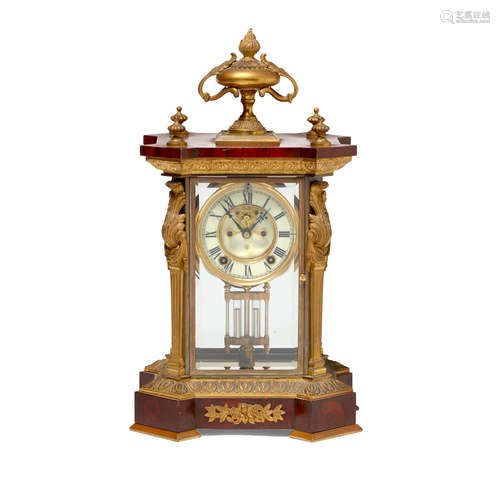 A Napoleon III style gilt bronze mounted stained wood Ansonia table clock