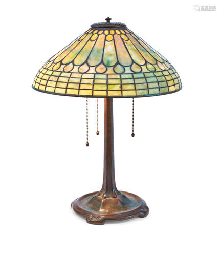 A Tiffany Studios Patinated Bronze and Leaded Glass Feather Table Lamp