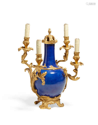 A Louis XV style gilt bronze mounted blue glazed porcelain four light candelabra