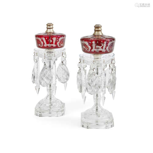 Early 20th century A Pair of clear and ruby overlay glass fluid lamps