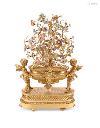 20th century A Louis XVI Style Floral Encrusted Gilt Bronze Figural Centerpiece