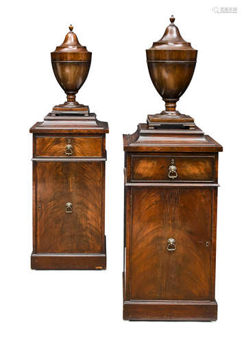 Late 19th century a Pair of George III style mahogany cutlery urns on pedestals