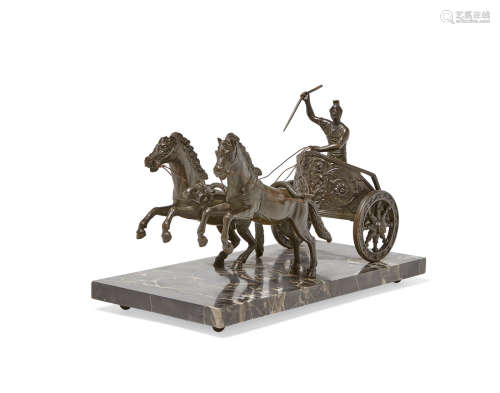 A Grand Tour style patinated bronze group of a charioteer and horses