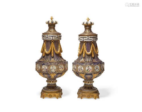 Early 20th century A pair of SÈvres style porcelain drum form covered urns with portraits of court beauties