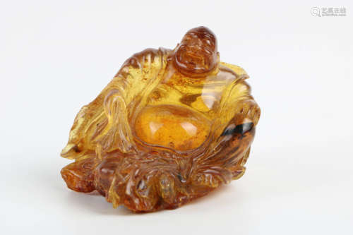 A Chinese Carved Amber Buddha