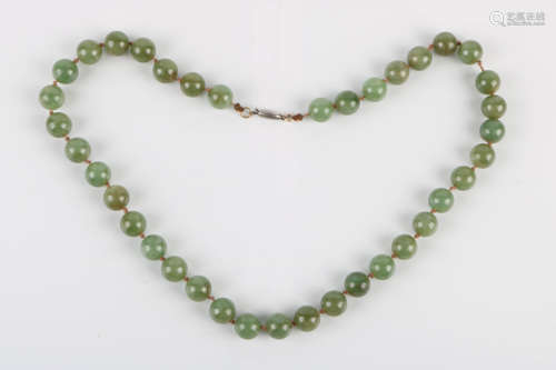 A Chinese Carved Jadeite Necklace