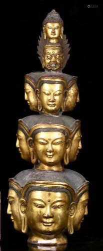 A GILT BRONZE BUDDHA WITH ELEVEN FACES