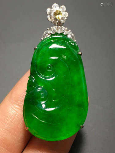 A GREEN JADEITE CARVED 