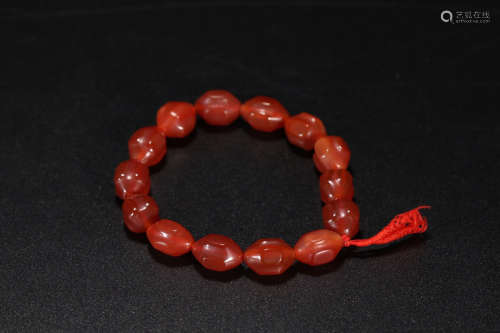 A RED AGATE PRISMATIC SHAPED BEADS BRACELET