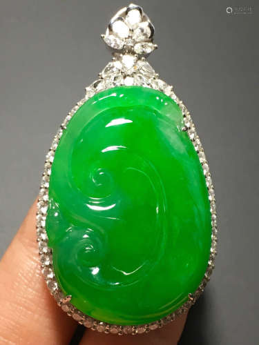 A GREEN JADEITE CARVED 