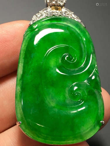 A GREEN JADEITE CARVED 