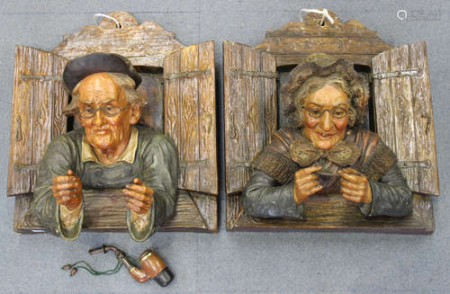 A pair of Austrian terracotta wall plaques, late 19th/early 20th century, modelled as an elderly man