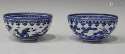 A pair of Japanese Hirado blue and white bowls, Meiji period, of hemi-spherical form, each painted