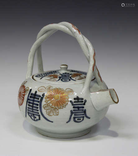 A Japanese Imari porcelain teapot and cover, early 18th century, of compressed globular form,