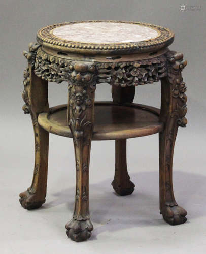 A Chinese hardwood jardinière stand, late 19th century, the circular top inset with a rouge marble